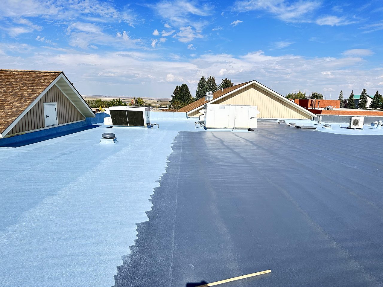 City of Cut Bank, Montana roof partly coated, showing the old surface next to the new coating