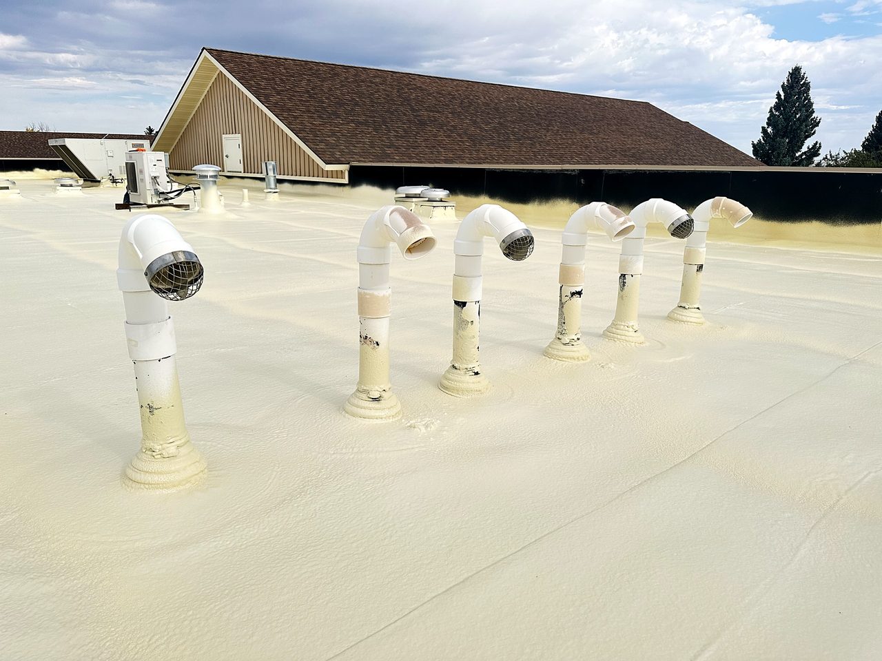 Freshly coated roof vents and pipe penetrations, City of Cut Bank, Montana